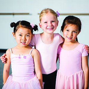 Young Group of Girl Friends at Dance Class A cute young diverse group of friends at dance class