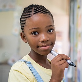 Girl-doing-math-at-whiteboard-950609318_6144x4080