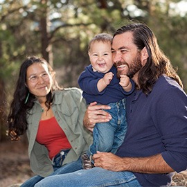 "Young family enjoying a day in nature, shallow DOF, father and son in focus"