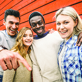 Happy multiracial friends group taking selfie with mobile smart phone - Young hipster people addicted by smartphone on social network community - Lifestyle technology concept on vivid contrast filter Happy multiracial friends group taking selfie with mobile smart phone - Young hipster people addicted by smartphone on social network community - Lifestyle technology concept on vivid contrast filter