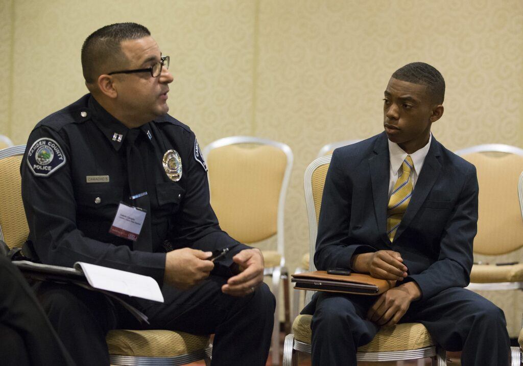 Police Officer Camacho and event attendee