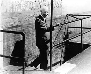 A historical photograph of Jim Casey at the original Seattle location of the American Messenger Company.